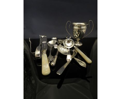 A silver trophy, engraved and a quantity of silver and plated flatware including caddy spoon, sugar nips, bread knife etc