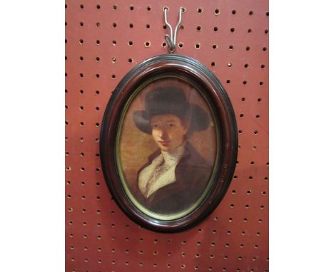 A portrait of lady in oval wood frame