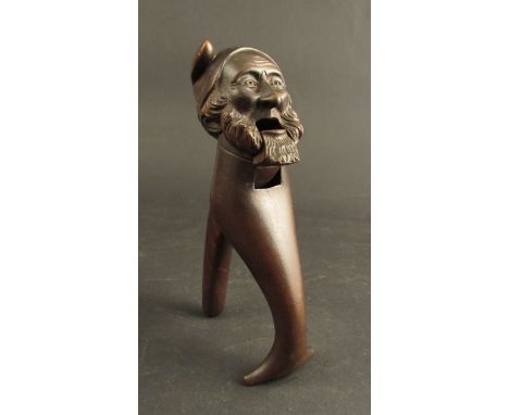 A carved hardwood nutcracker in the form of bearded man 