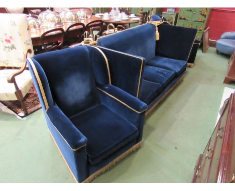 A Knoll three seater sofa together with a pair of matching armchairs with tassel detail