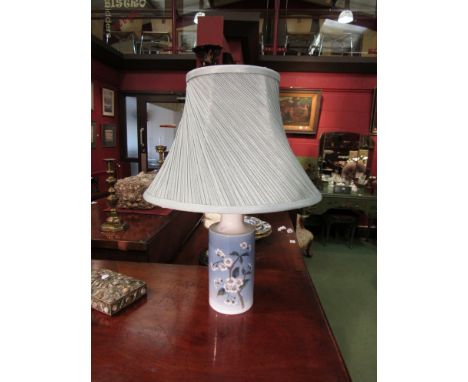 A Royal Copenhagen lamp base with blossom design together with a teal pleated shade