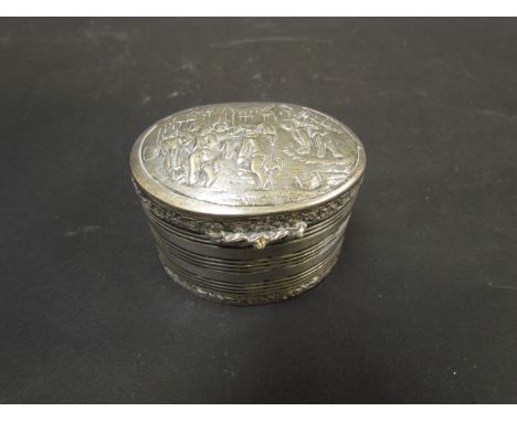 A 19th Century continental silver barrel form trinket pot with pictorial scene depicting musicians and dancers, 74g