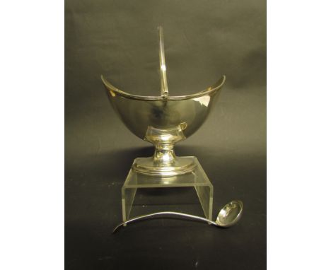 A Georgian silver sugar basket of boat form, London circa 1800, 15cm long, 212g with associated ladle