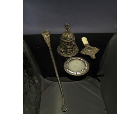 A silver bell with lion and shield knop, high relief of figures and swags, silver crocodile skin effect photograph frame, sil