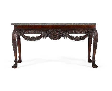 A CARVED MAHOGANY CONSOLE TABLE IN IRISH 18TH CENTURY STYLE, SECOND HALF 19TH CENTURY With mottled green marble top79cm high,