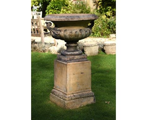 A TERRACOTTA CENTREPIECE ON PEDESTALBY JAMES PULHAM BROXBOURNE, 19TH CENTURYOf twin handled swept Campana form, with lobed bo