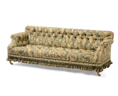 A VICTORIAN WALNUT AND UPHOLSTERED SOFAIN THE MANNER OF HOLLAND & SONS, CIRCA 1870The front castors stamped 'COPE COLLINSON P