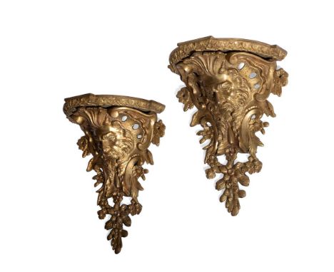 A RARE PAIR OF LOUIS XV ORMOLU WALL BRACKETS  CIRCA 1745-49 Of ornate bearded mask form, within elaborate pierced scrolling s