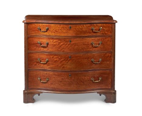 A GEORGE III MAHOGANY SERPENTINE COMMODEIN THE MANNER OF THOMAS CHIPPENDALE, CIRCA 1765The moulded top above four long gradua