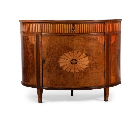 Y A GEORGE III HAREWOOD, SATINWOOD AND MARQUETRY BOWFRONT COMMODEATTRIBUTED TO WILLIAM MOORE, CIRCA 1780With a frieze drawer 