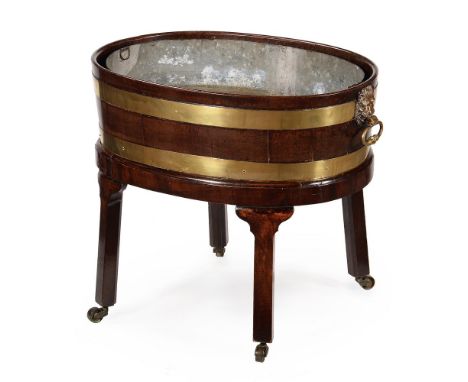 A GEORGE III MAHOGANY AND BRASS BOUND WINE COOLER IN THE MANNER OF THOMAS CHIPPENDALE, CIRCA 1770 58cm high, 66cm wide, 47cm 