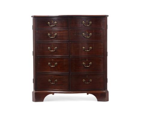 A GEORGE III MAHOGANY SERPENTINE FRONTED CLOTHES PRESSIN THE MANNER OF THOMAS CHIPPENDALE, CIRCA 1770 The half-hinged top abo