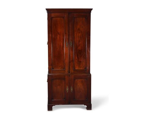 A GEORGE II MAHOGANY ESTATE CABINET CIRCA 1750 The upper doors opening to various shelves and pigeon holes, the lower doors o