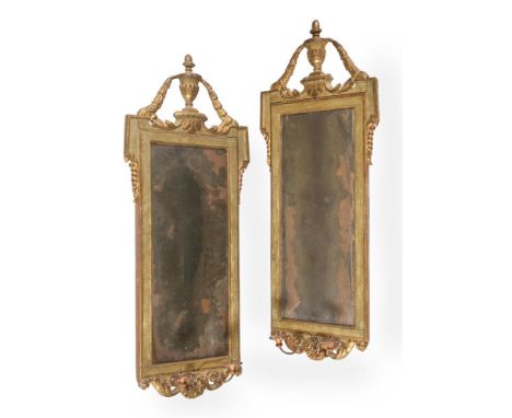 A PAIR OF NORTH ITALIAN GREEN PAINTED AND PARCEL GILT WALL MIRRORS LATE 18TH CENTURY each 122cm high, 47cm wide Condition Rep