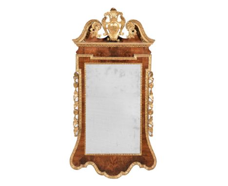 A GEORGE II WALNUT AND GILTWOOD WALL MIRRORCIRCA 1740 120cm high, 62cm wideProvenance: Private Collection, Guernsey. Conditio