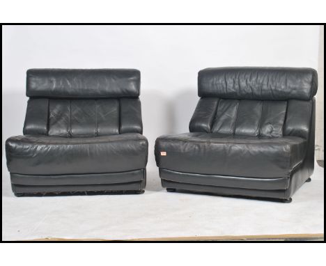 A retro 20th century modular Nucleus black leather sofa by Tetrad Associates each unit with cushioned head rest, back and sea