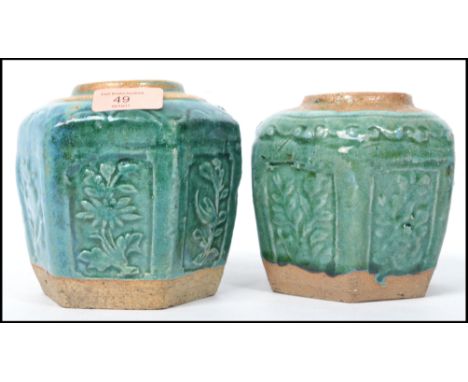 A pair of Oriental Chinese ceramic stoneware ginger gars of hexagonal form having a green glaze finish. Measures: 11cm high x