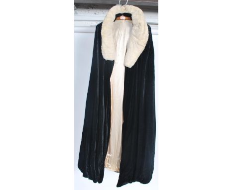 A stunning early 20th century ladies velvet cloak having a real fur collar, approximate size 8 / 10&nbsp;