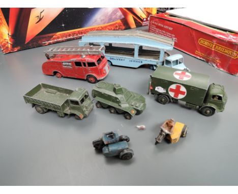 Seven Dinky playworn diecasts, AA Motocycle and Side Car, Police Motocycle and Side Car, Car Transporter, Military Ambulance,