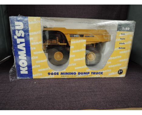 A First Gear 1:50 scale diecast, Komatsu 960E Mining Dump Truck, in yellow, in original polystyrene packaging and window box 