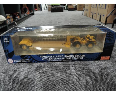 A Norscot 1:50 scale diecast, Towhaul Classic Low Boy Trailer with Caterpillar 784C Tractor, in original window box 58230