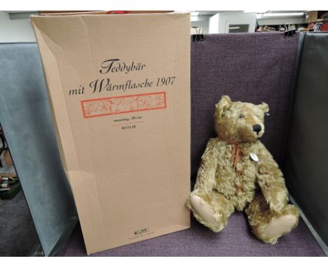 A modern Steiff limited edition Bear, Teddy Bear with hot water bottle 1907 Replica, white tag 406621, with certificate 01217