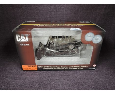 A Norscot limited edition celebrating 100 years on track 1:50 scale diecast, CAT D11R Track Type Tractor with Metal Tracks in