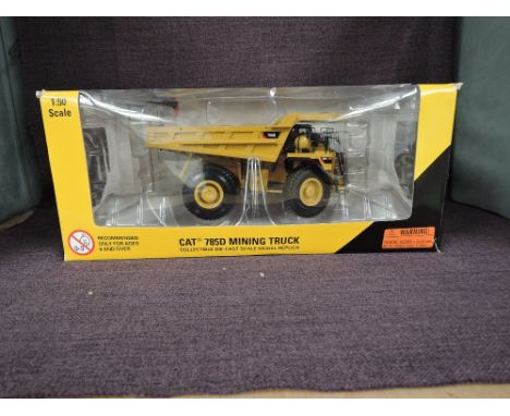 A Norscot 1:50 scale diecast, Cat 785D Mining Truck, in original window box 55216