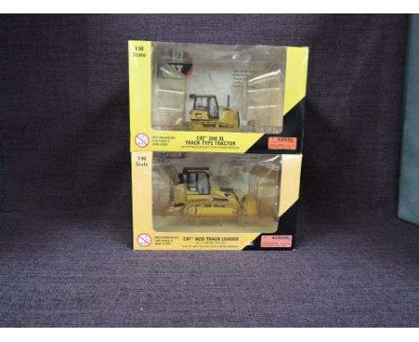 Two Norscot 1:50 scale diecasts, CAT D6K XL Track Type Tractor in yellow, in plastic packaging and in window display box 5519