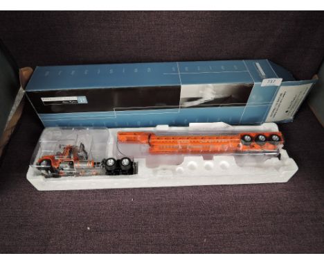 A Tonkin 1:53 scale diecast, Peterbilt 379 Day Cab, Turnpike Authority with Lowboy, in original polystyrene packaging and box