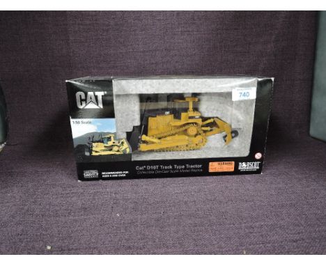 A Norscot 1:50 scale diecast, CAT D10T Track Type Tractor in yellow, in polystyrene packaging and in window display box 55158