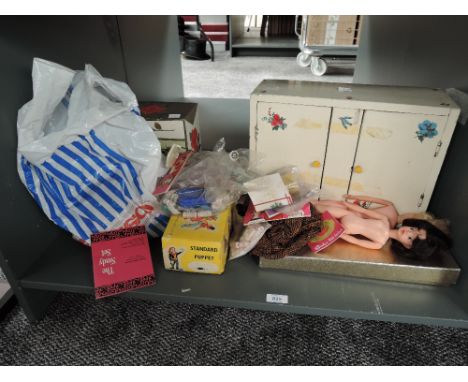 A collection of Sindy and similar clothing and accessories including The Sindy Set and Tressy Fashion booklets, Palitoys Tres