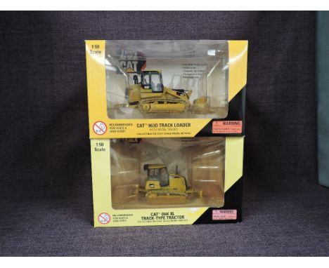 Two Norscot 1:50 scale diecasts, CAT D6K XL Track Type Tractor in yellow, in plastic packaging and in window display box 5519
