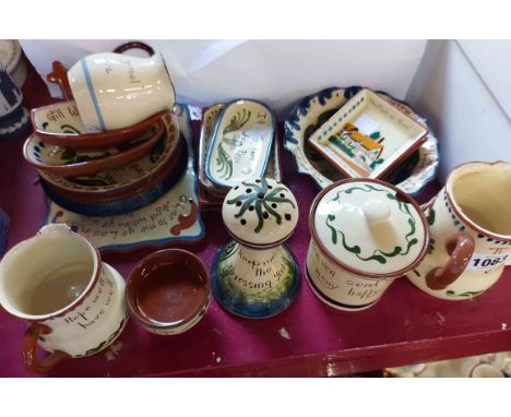 A quantity of Torquay Pottery items including Longpark cockerel decorated hatpin holder, baby's plate, Watcombe hair curler s