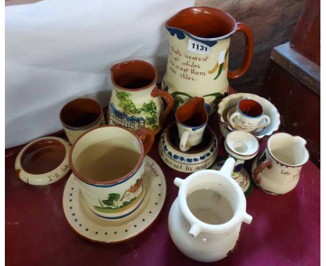 A quantity of Torquay Pottery items including Dartmouth puzzle jug, Aller Vale miniature tyg, etc.