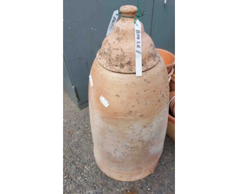 A terracotta rhubarb forcer with lid