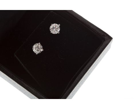 PAIR OF DIAMOND SINGLE STONE EARRINGS, each set with a round brilliant cut stone of approximately 0.45 carats, marked 750 to 