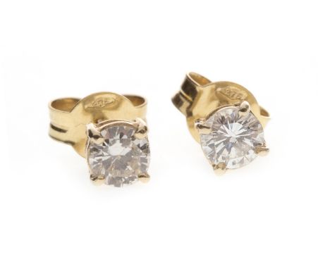 PAIR OF DIAMOND SINGLE STONE EARRINGS, each set with a round brilliant cut diamond of approximately 0.30 carats, marked 375 t