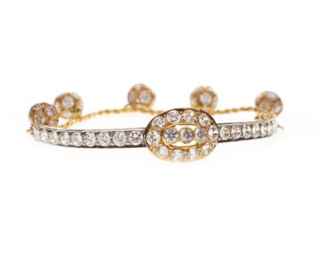 ORNATE GEM SET BRACELET, formed by a rigid curving bar section set all over with faceted white gems, with a chain section to 