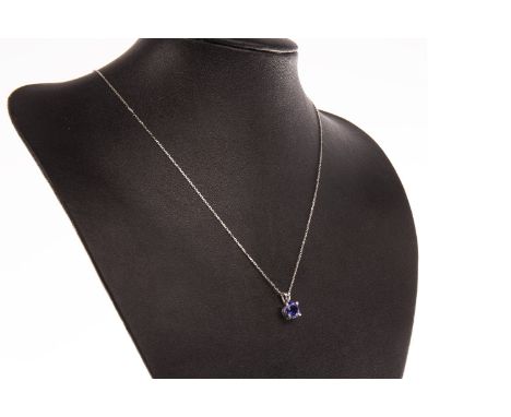 TANZANITE PENDANT ON CHAIN, the round stone of approximately 1.94 carats, marked 750 to the reverse, on an eighteen carat gol