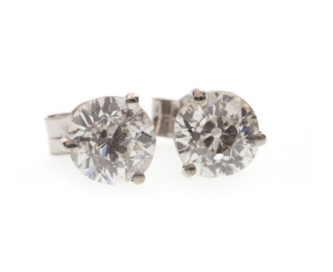 PAIR OF DIAMOND SINGLE STONE EARRINGS, each with a three claw mounted old cut diamond of approximately 0.70 carats, marked 75