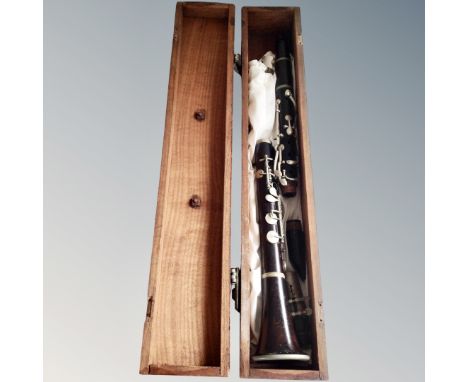 A vintage wooden clarinet by JTL of Paris, in wooden box.