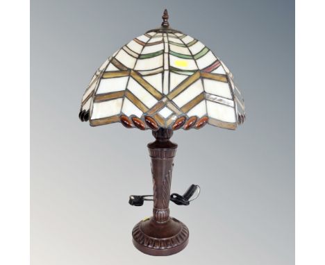 A Tiffany style table lamp with leaded glass shade 