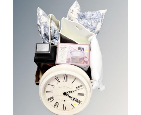 Two contemporary magazine racks together with cushions, circular wall clock, Hurricane lamp, boxed jam pan