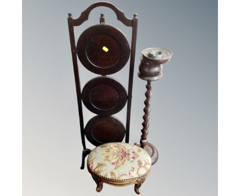 A barley twist smoker's stand together with a three tier folding cake stand and a tapestry upholstered footstool.