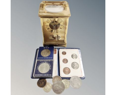 A Rapport brass cased carriage clock together with assorted coinage including Britain's First Decimal Coin set, crowns etc.