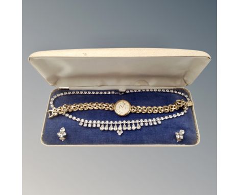 A lady's Rotary gold plated wristwatch together with a costume necklace and earring set in box.