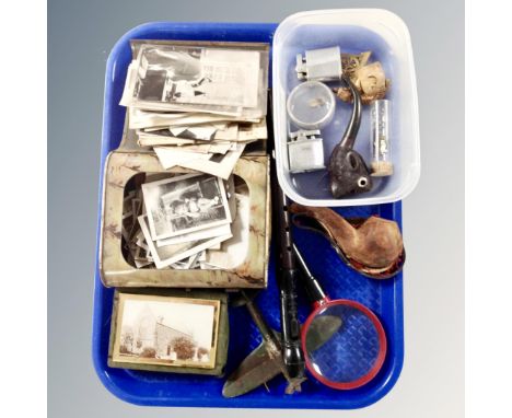 A tray of pipes, pocket lighters, recorder, miniature spitfire, vintage tin containing monochrome photographs