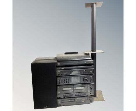 A Sanyo hifi system with speakers, remote and speaker stands.