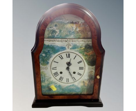 A contemporary eight day bracket clock with key with hunting scene dial 